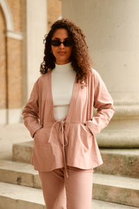 feminine pink jacket with tie front and pockets
