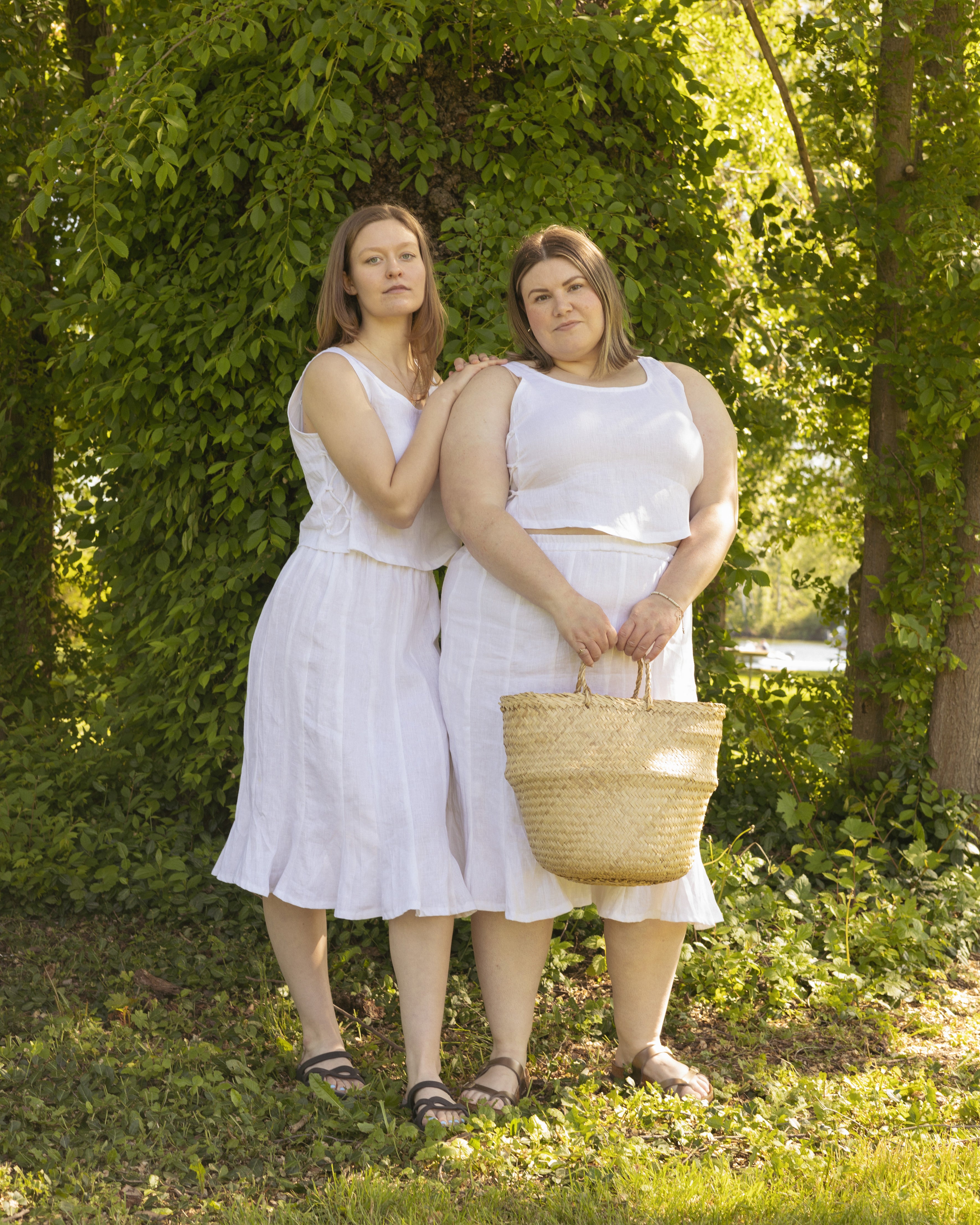 White linen skirt worn by a model wearing small and one wearing 2x