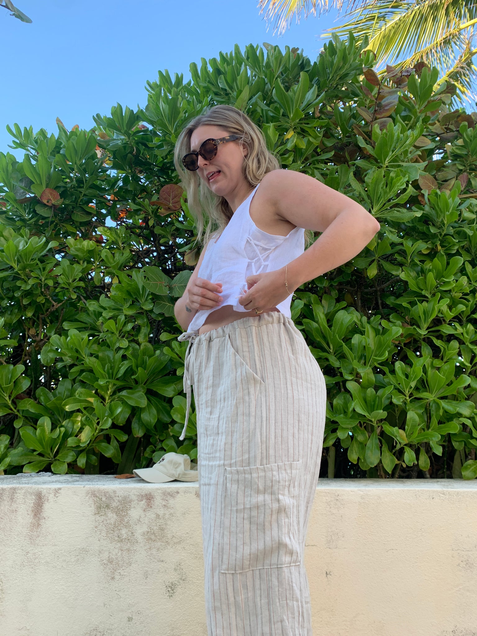 White Linen tank top and stripped cargo pants