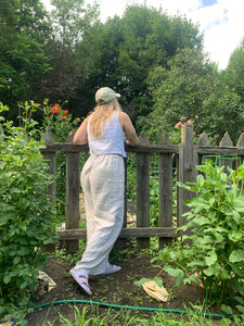 Wide leg linen pants worn with white linen tank top