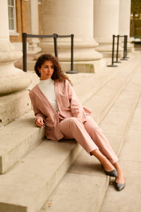 pink matching set with white turtleneck
