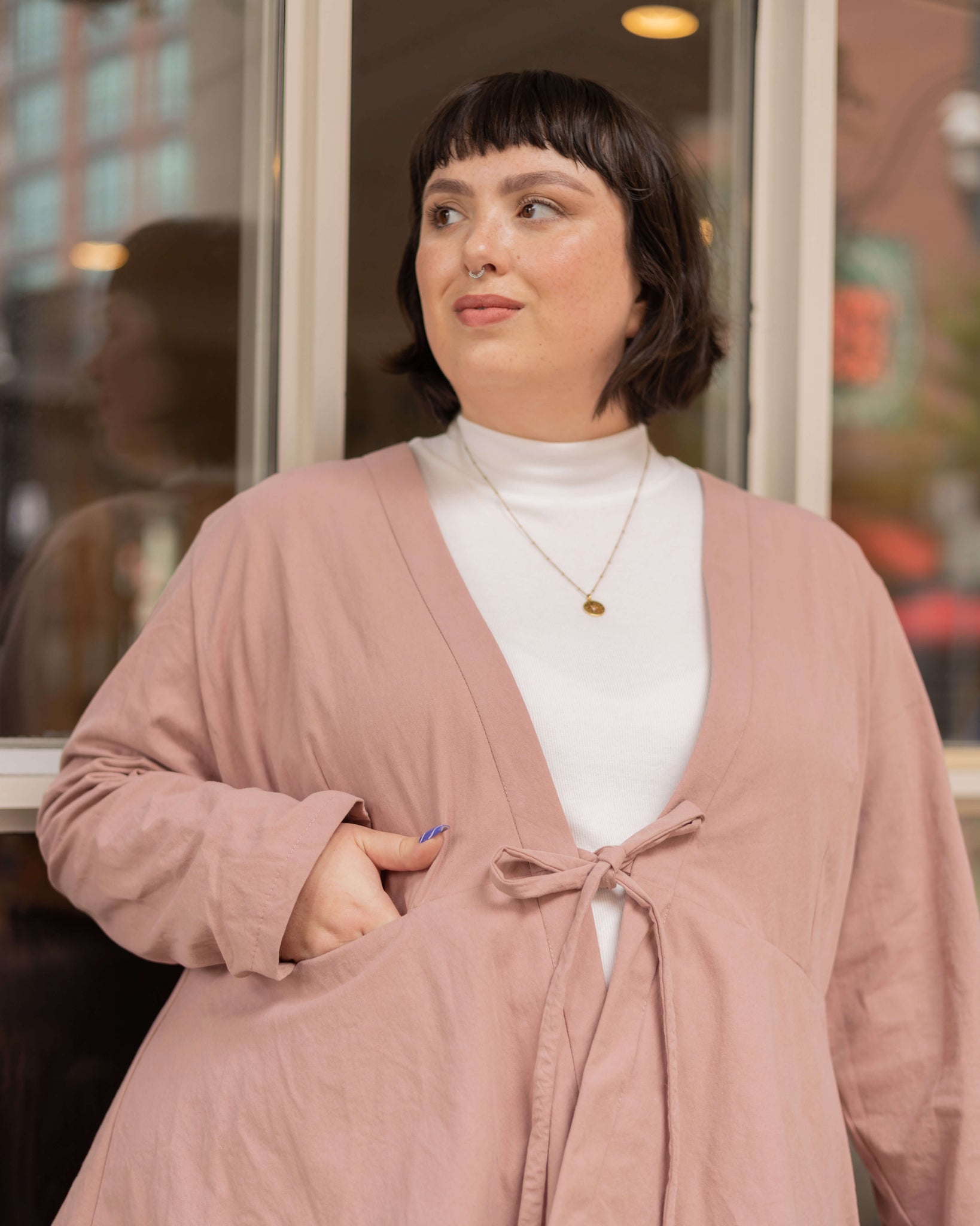 blush pink fall jacket with white turtleneck