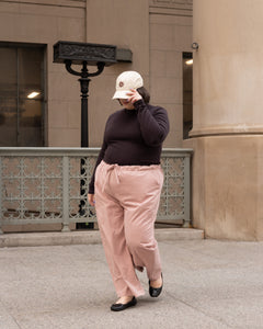 Wide leg blush pink cargo pants and dark brown turtleneck