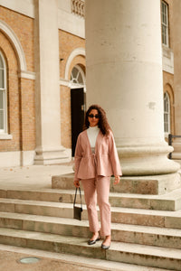 Matching set organic cotton pink suit worn with cream turtleneck