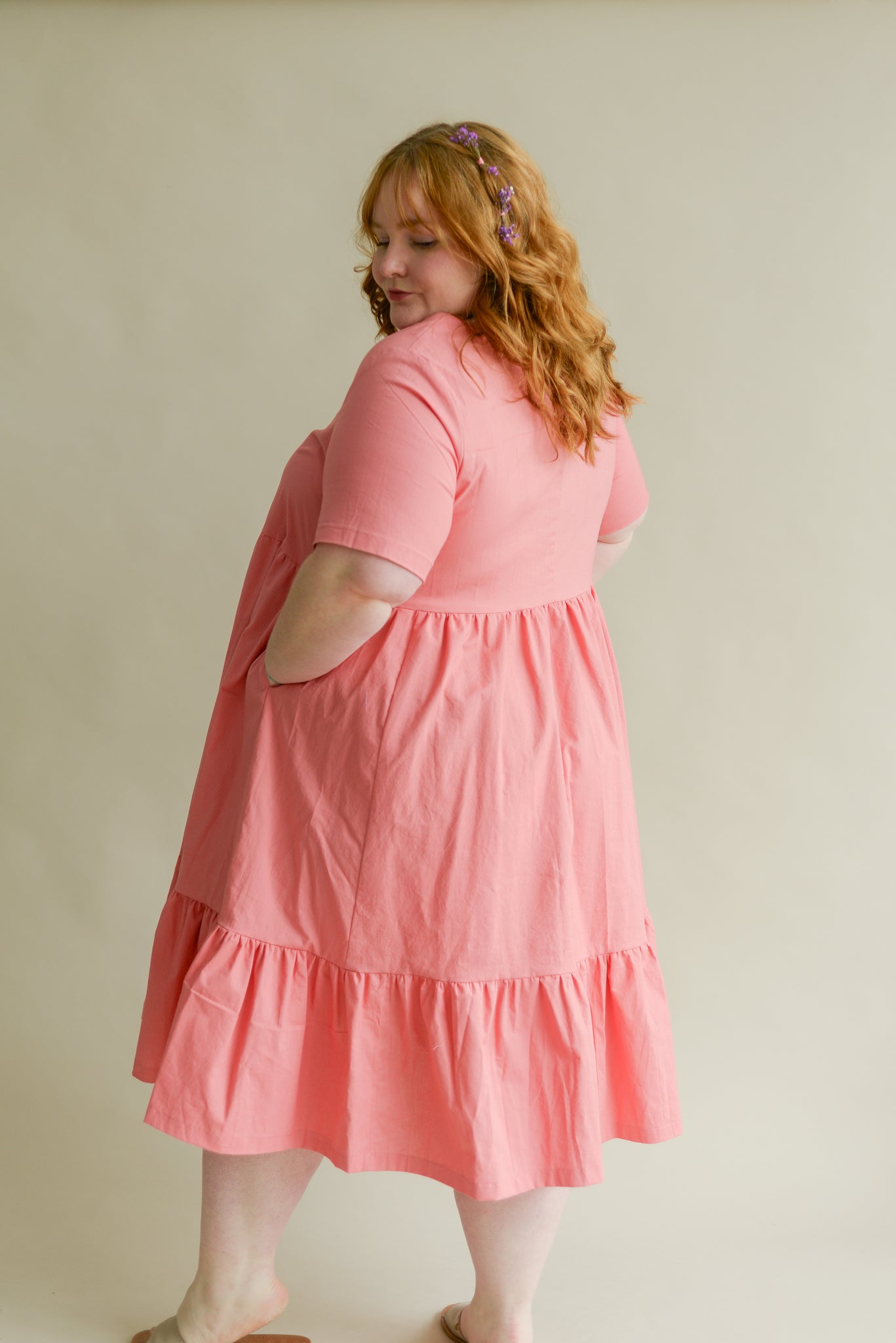 back view of a bright pink organic cotton dress